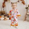 imageKuriozud Kids Toddler Girl Halloween Pajamas Fuzzy Trim Long Sleeve Button Down Shirt Top and Pants 2pcs Pjs Sets SleepwearFloral Pumpkin Ghost Pink